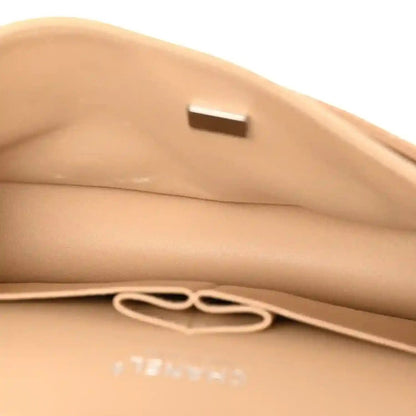 Chanel beige caviar quilted interior pocket with pull tab detail