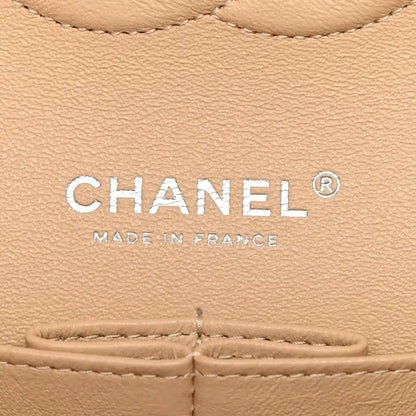 Chanel logo patch on beige leather caviar bag with “MADE IN FRANCE” text