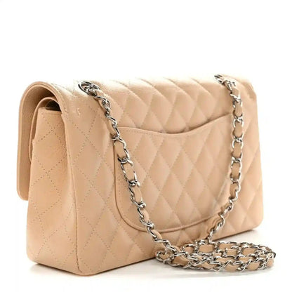 Chanel beige quilted caviar shoulder bag, side view with chain strap and flap
