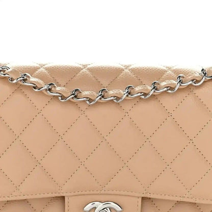 Chanel beige quilted caviar flap with chain strap and CC logo detail