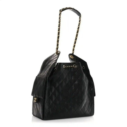 Black quilted leather handbag with chain handle and rectangular front flap