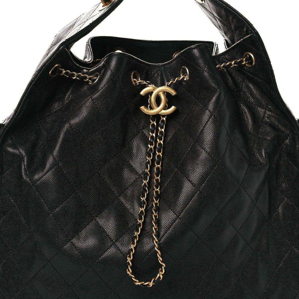 Black quilted leather handbag with CC logo clasp and long gold chain