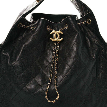 Black quilted leather handbag with CC logo clasp and long gold chain