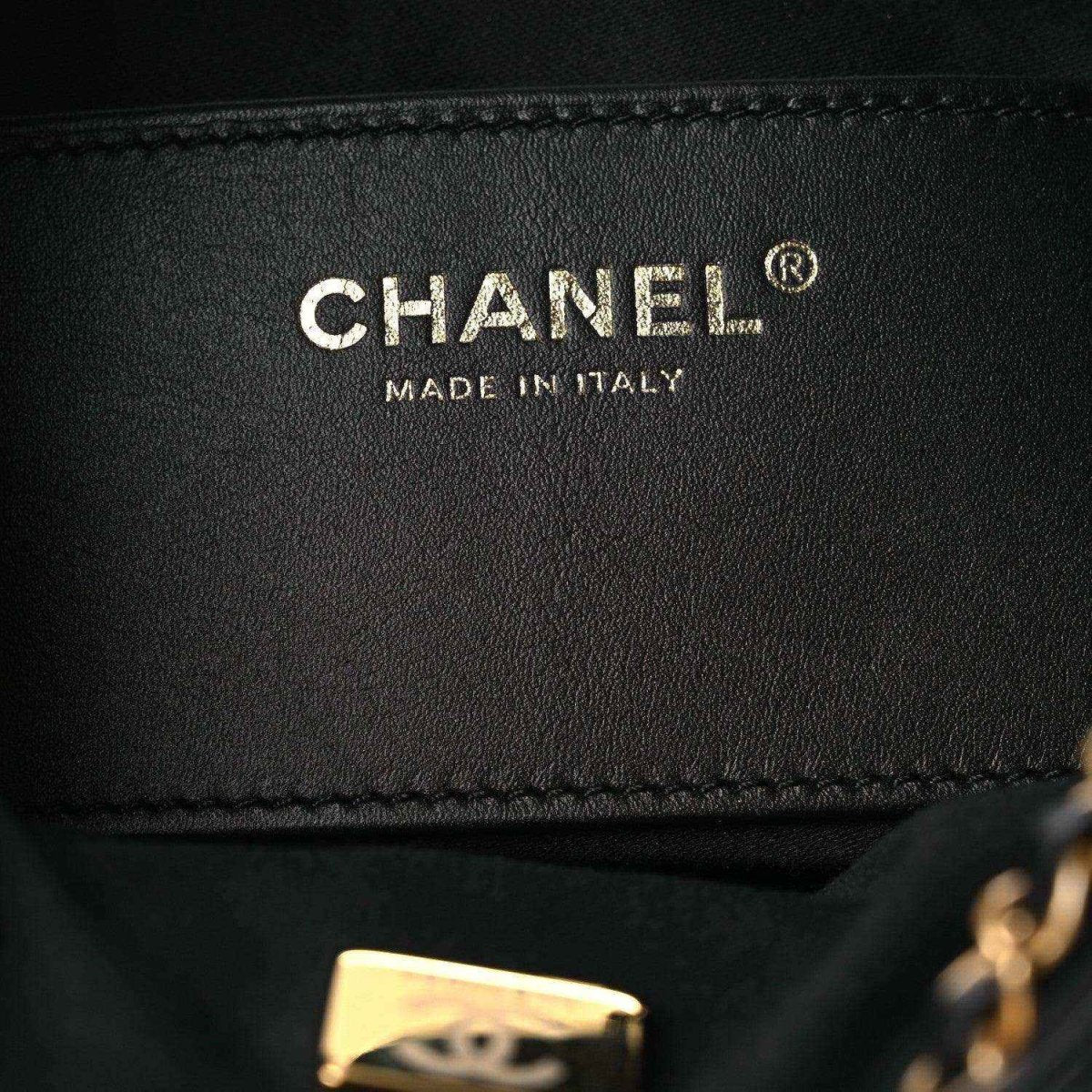 Black leather handbag lining with CHANEL and Made in Italy label