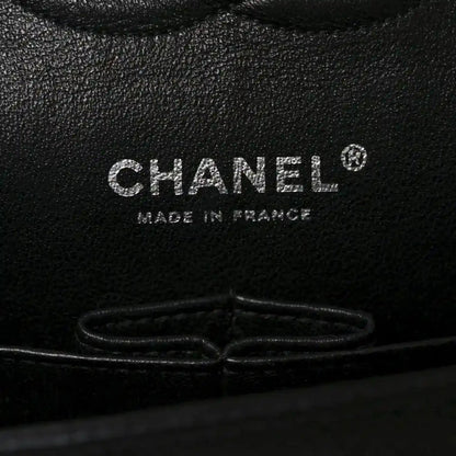 Black caviar leather interior stamp reading CHANEL and MADE IN FRANCE