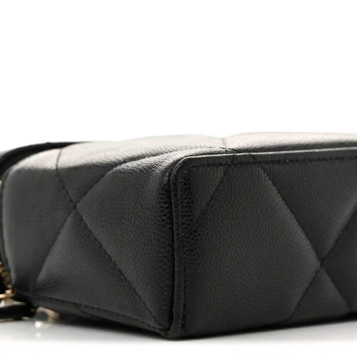 Black quilted leather slim vanity bag side panel with zipper and stitched seams