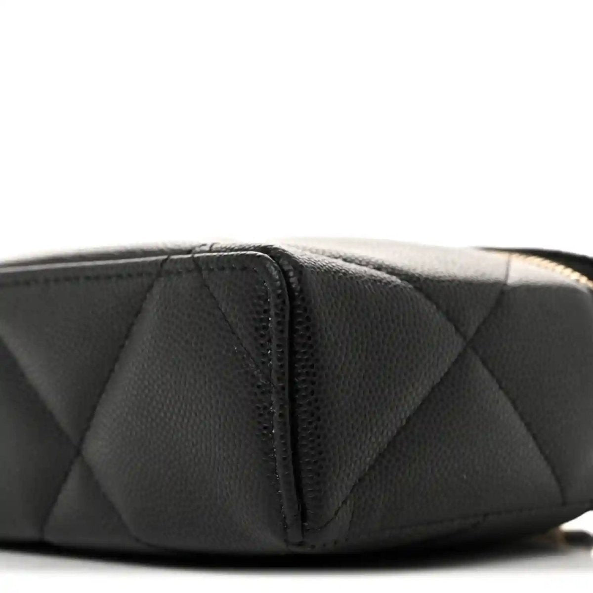 Black quilted leather slim vanity bag end panel with vertical seam detail