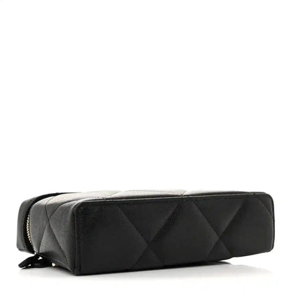 Black quilted leather slim vanity bag with curved top and zipper detailing