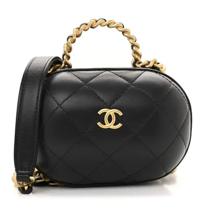 Black quilted lambskin vanity chain case with gold CC logo and top handle
