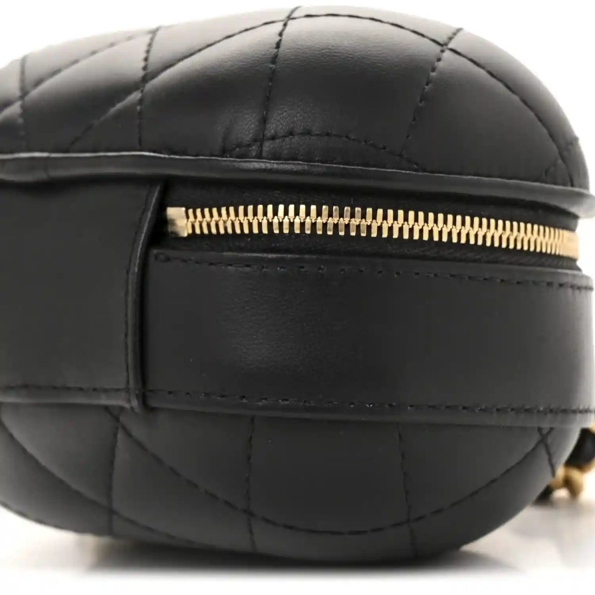 Black quilted vanity case with gold zipper and front panel stitching detail