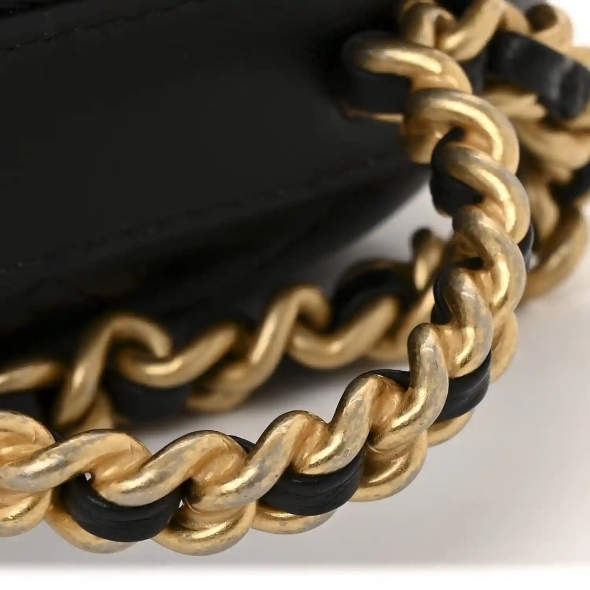 Black quilted lambskin chain case with gold link chain