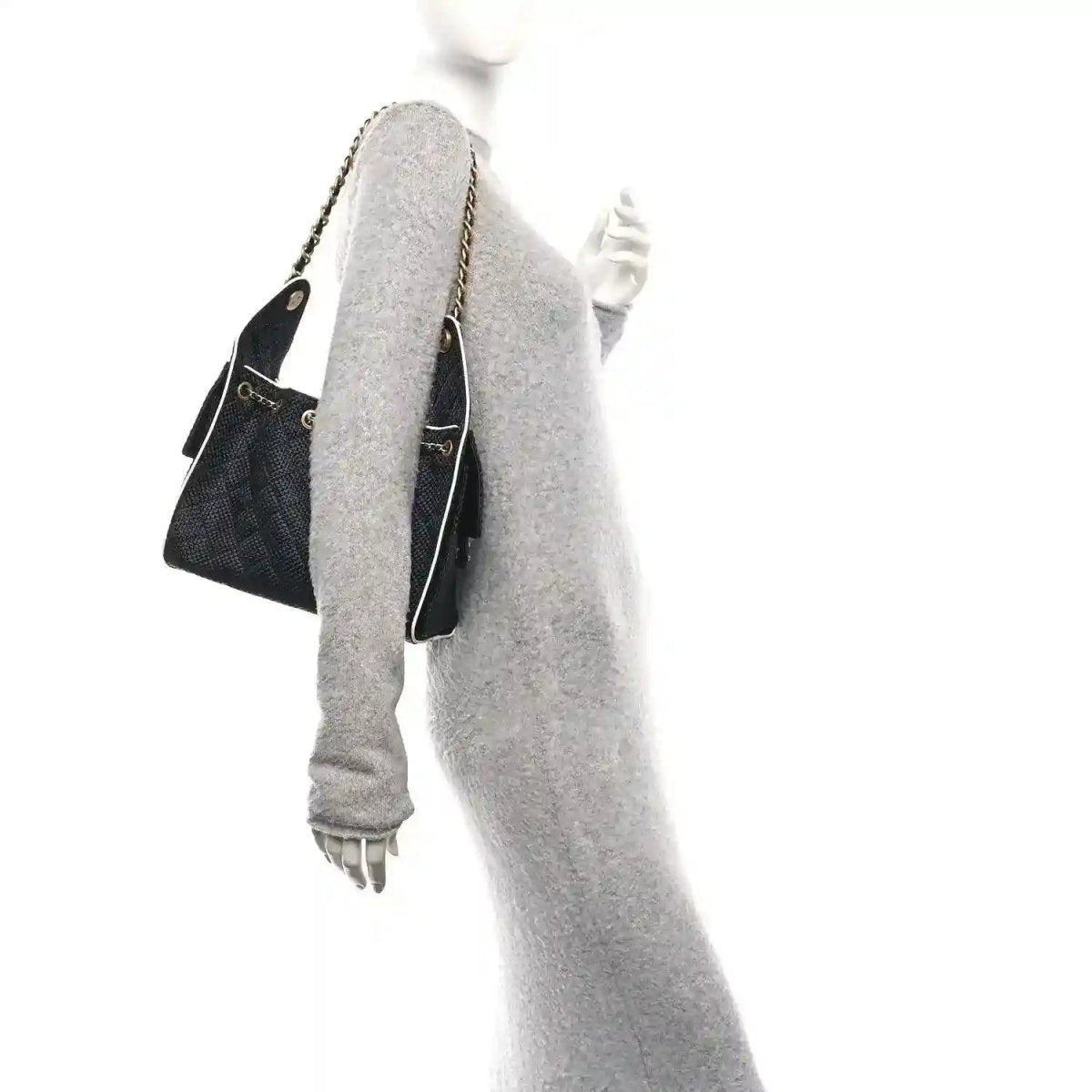 Chanel small handbag, black textured body with chain strap and pale lining