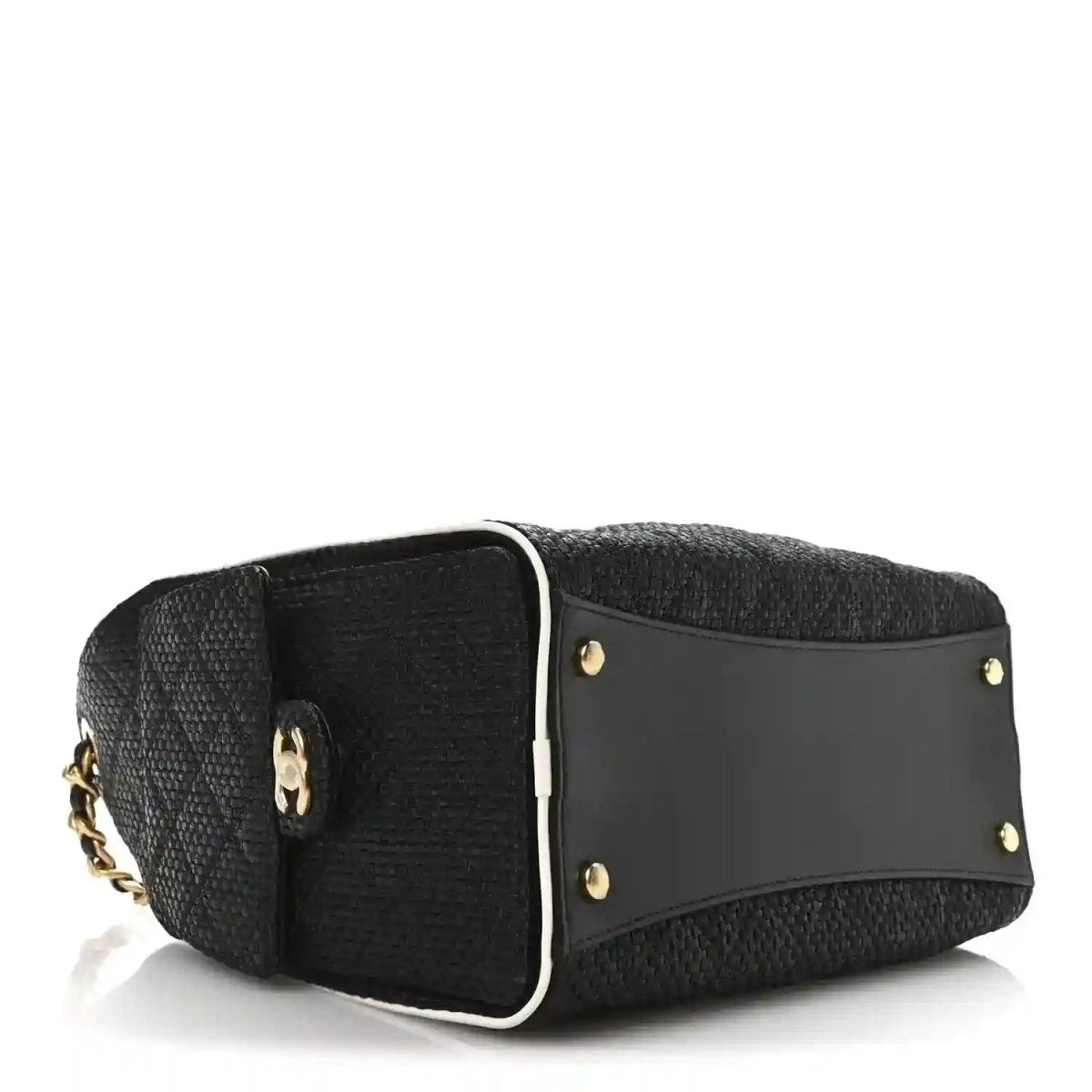 Chanel small handbag side view, black textured body with gold stud accents and tab