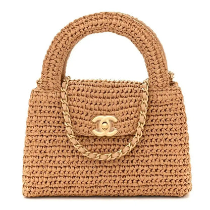 Dark beige braided raffia nano flap bag with Chanel turn-lock and chain strap