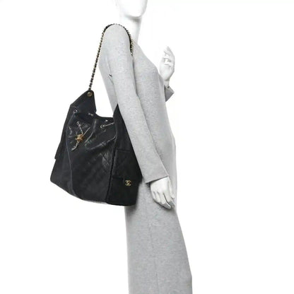 Black quilted shoulder handbag with chain strap and front logo detail