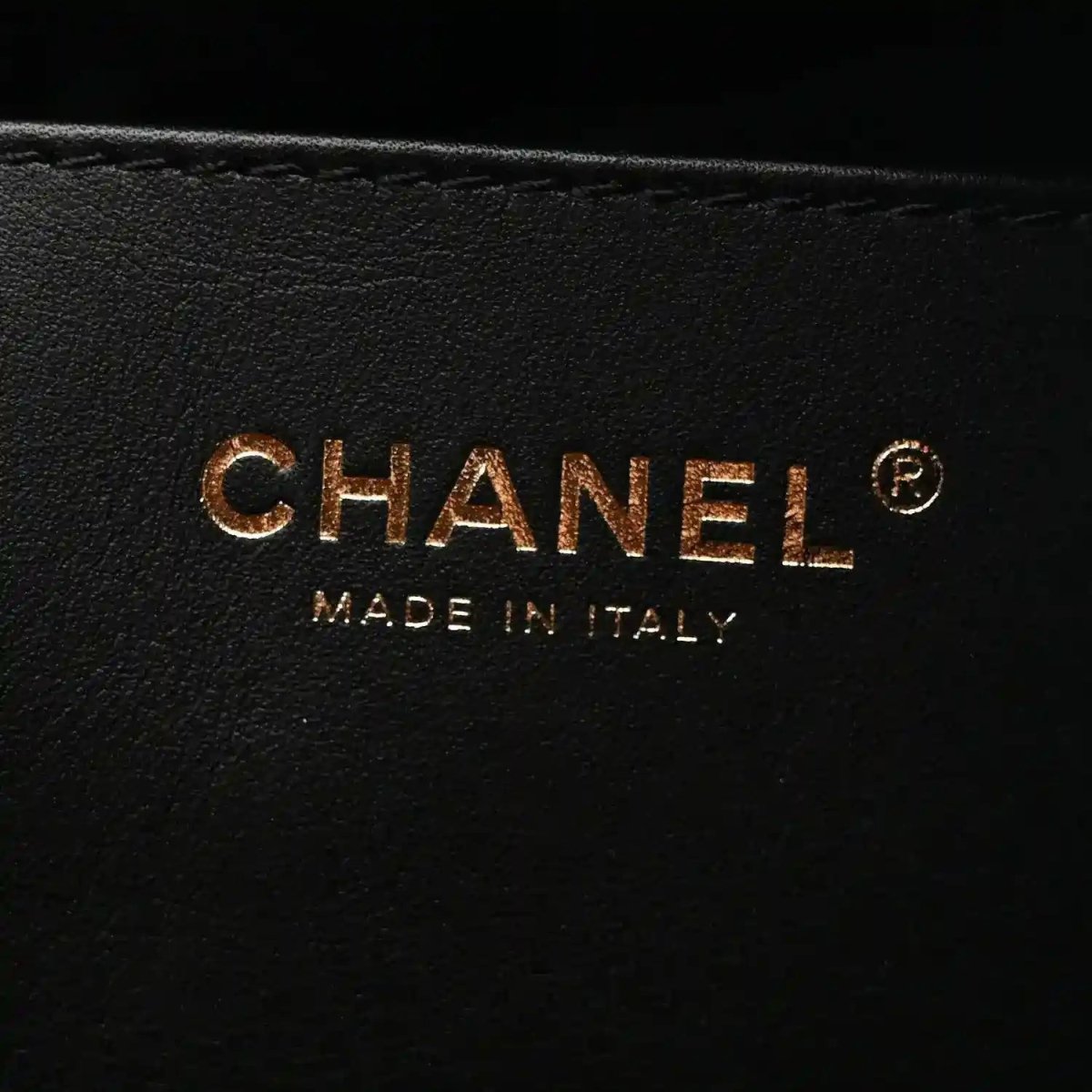 CHANEL and MADE IN ITALY stamp on black leather lining