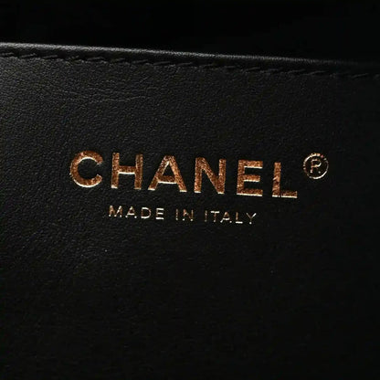 CHANEL and MADE IN ITALY stamp on black leather lining