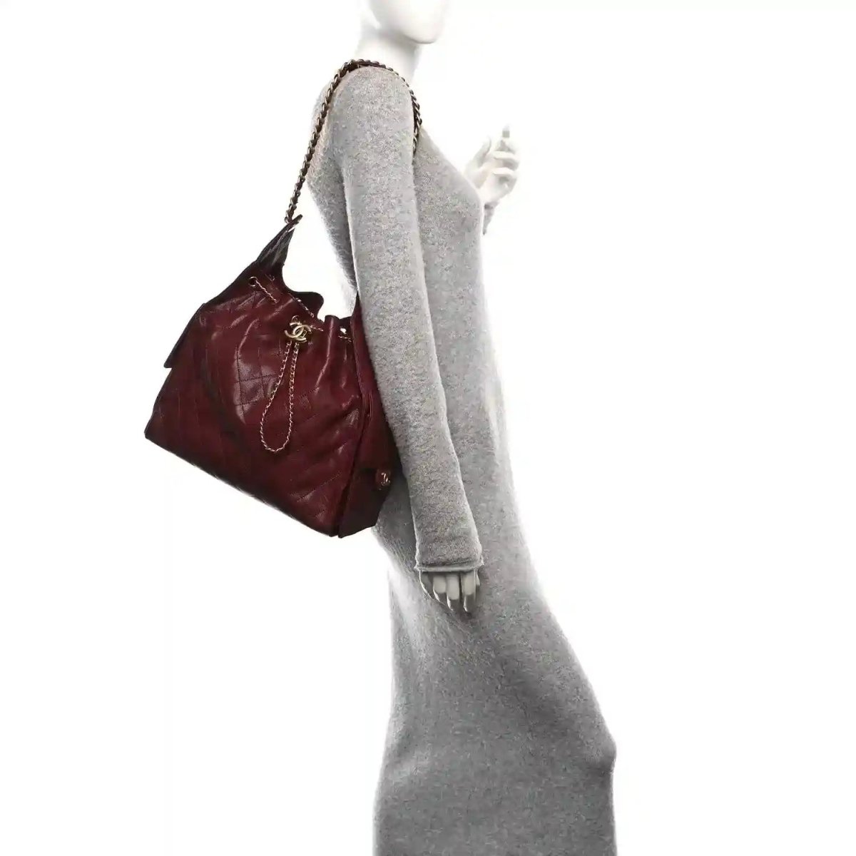 Burgundy quilted Chanel flap bag with chain shoulder strap and CC detail