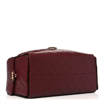 Burgundy quilted Chanel bag with chain handle and front flap seam