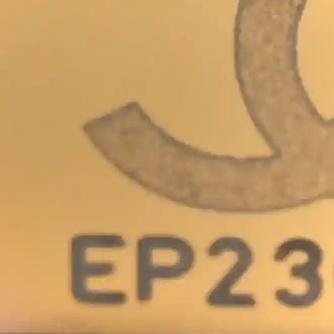 Burgundy leather bag marking EP23 with circular stamp detail
