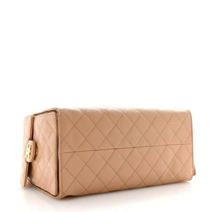 Beige quilted calfskin medium handbag with chain strap and clasp