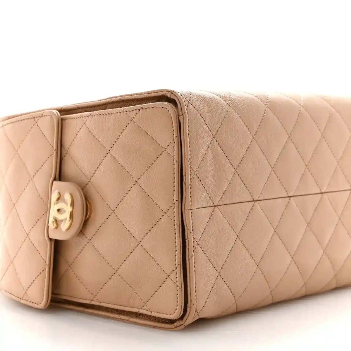 Beige quilted leather handbag with flap pocket and gold hardware at front