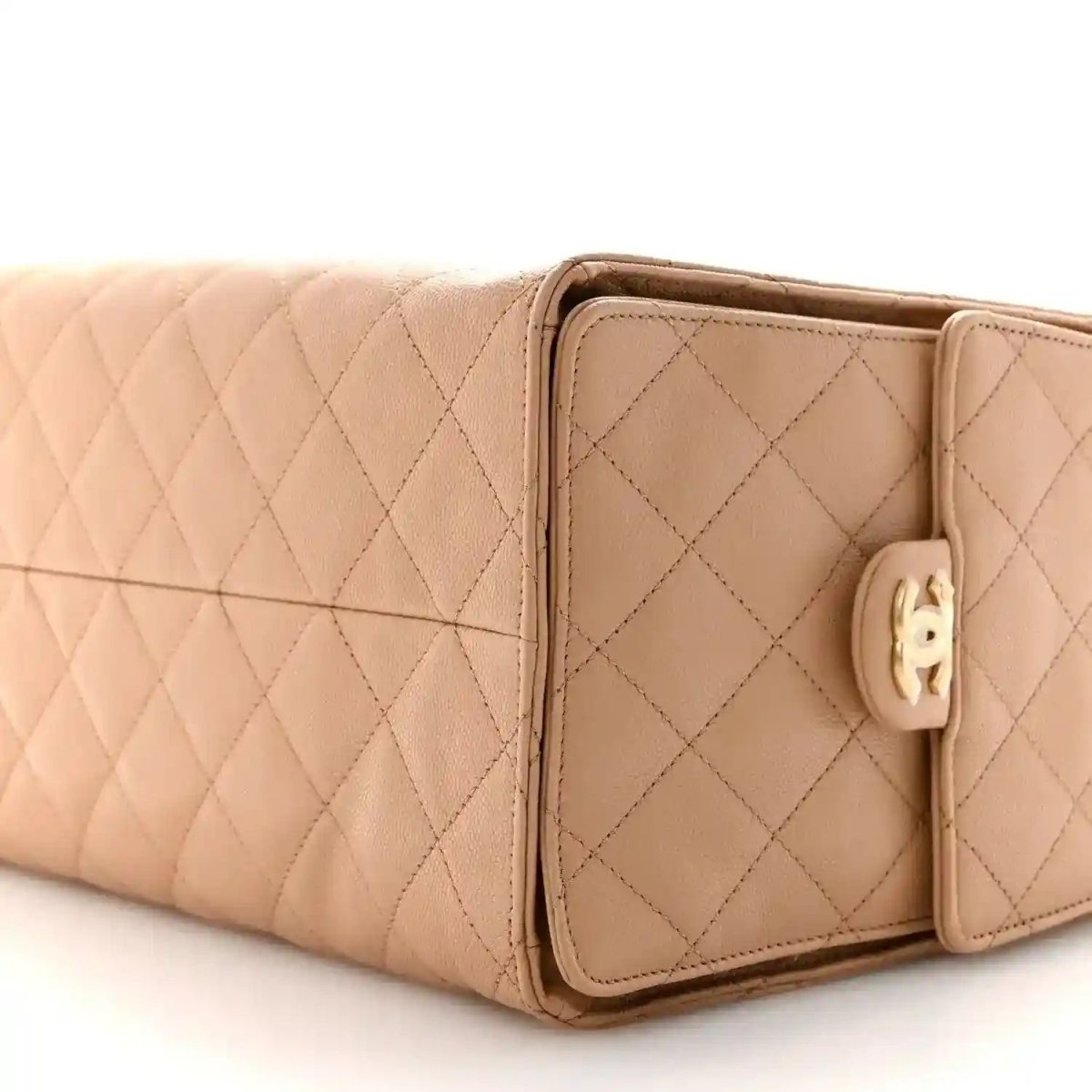 Beige quilted leather handbag with front flap pocket and stitched panel edges