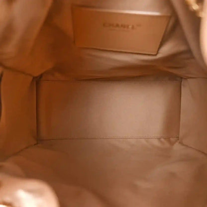 Beige quilted handbag interior lining with stitched rectangular pocket