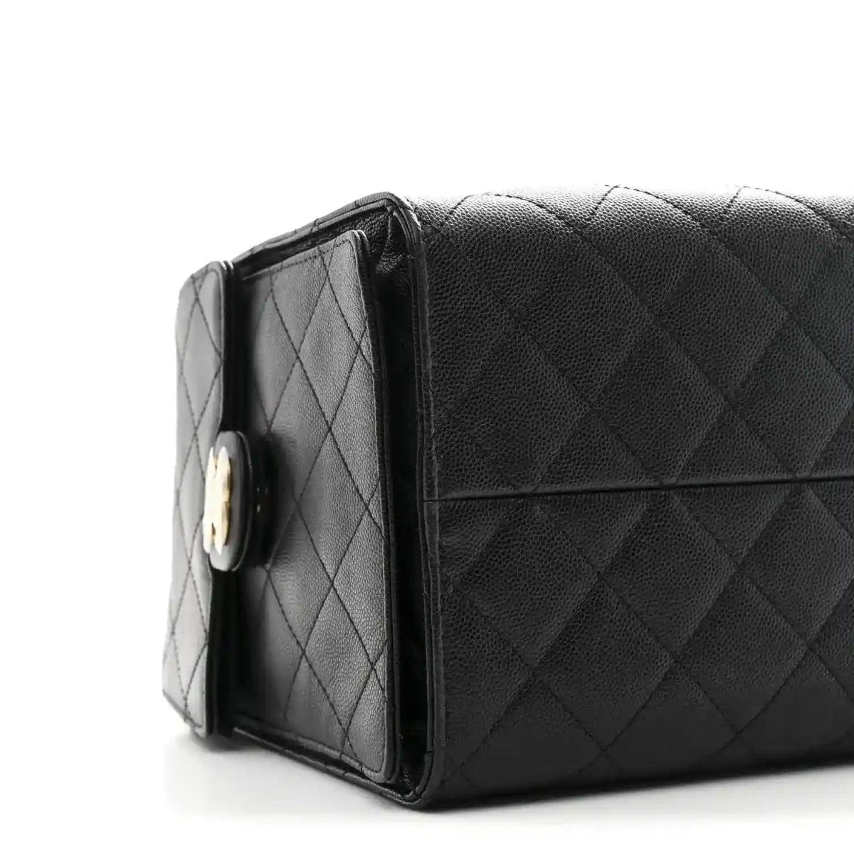 Black quilted caviar handbag with top flap and gold-tone turn-lock clasp