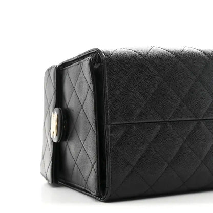 Black quilted caviar handbag with top flap and gold-tone turn-lock clasp