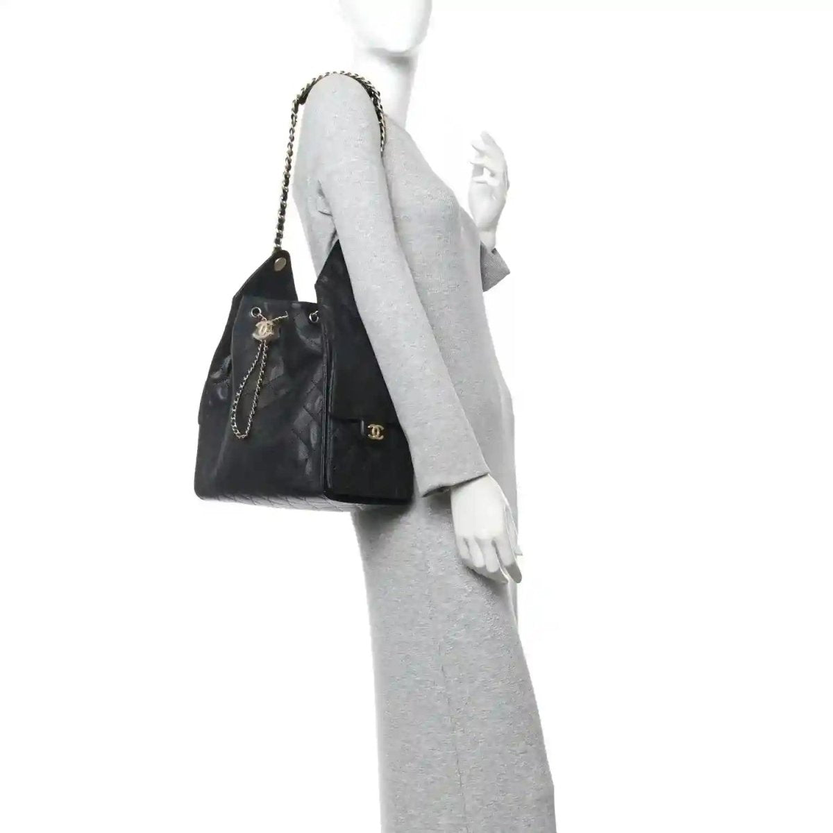 Black quilted handbag with chain shoulder strap and front logo accent