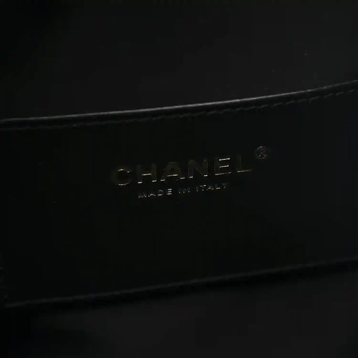 Black handbag lining with embossed brand lettering