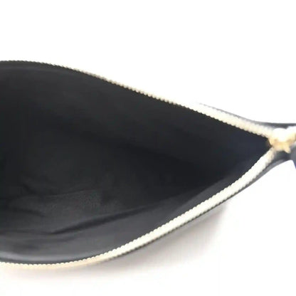 Black interior with chain and zipper-edge trim detail