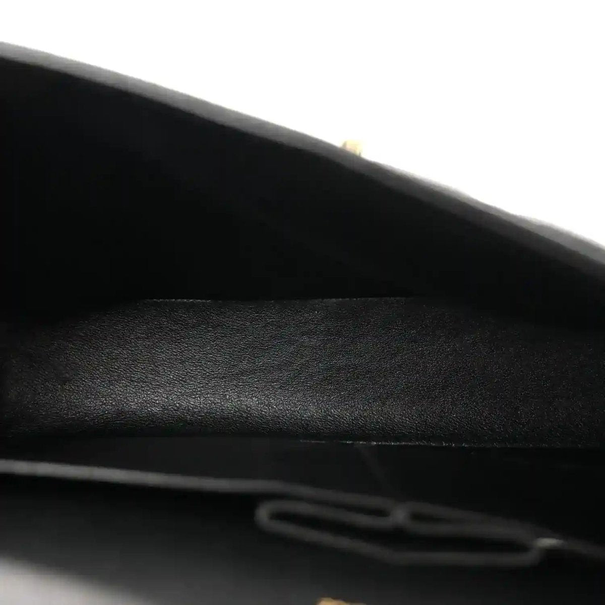 Chanel double flap bag interior closeup with black lining and seam detail