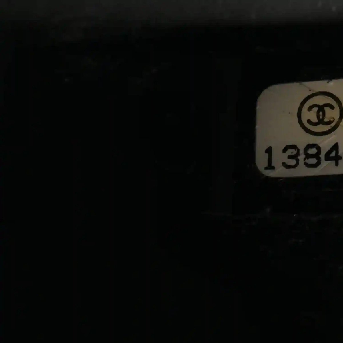 Chanel interior serial tag with CC logo and 1384 code