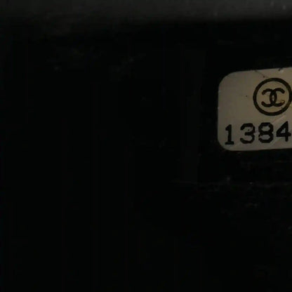 Chanel interior serial tag with CC logo and 1384 code
