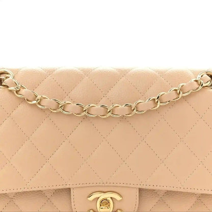 Beige quilted double flap bag top with gold chain strap and CC clasp center