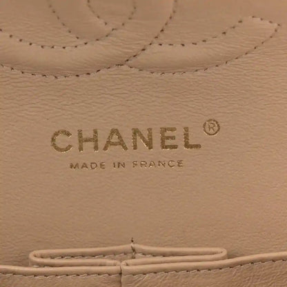 Beige leather bag interior label with CHANEL and MADE IN FRANCE text