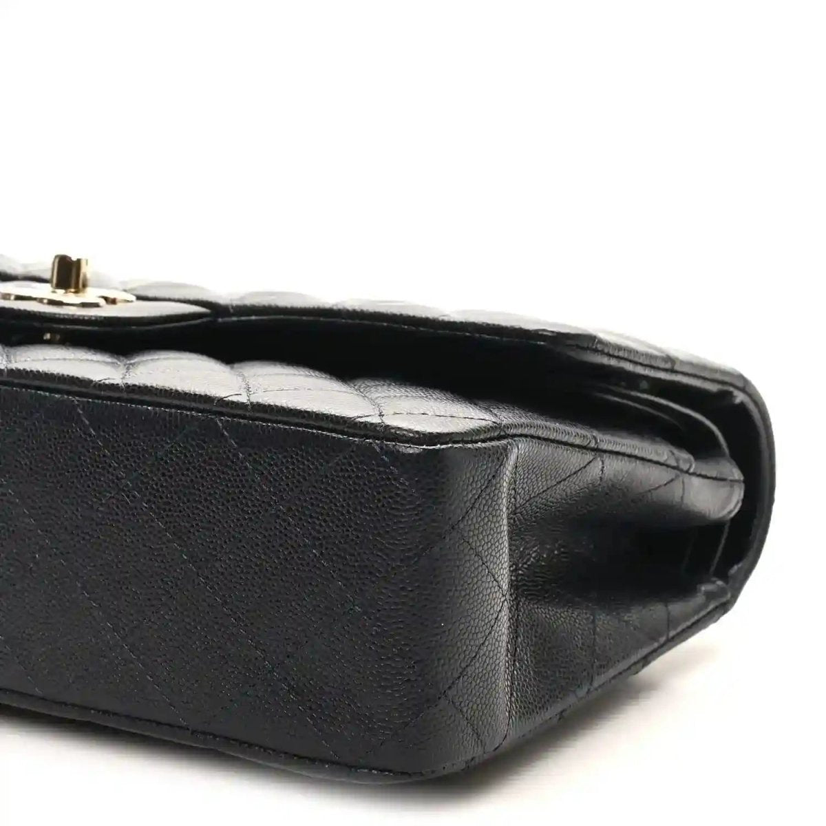 Quilted caviar leather flap bag side with gold hardware and structured edge