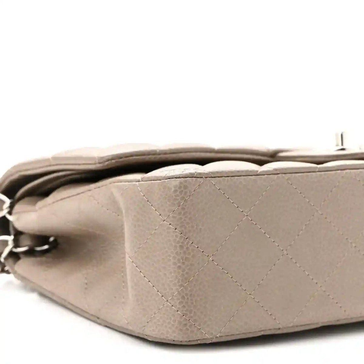 Taupe quilted leather flap bag back view with silver chain strap and hidden fold