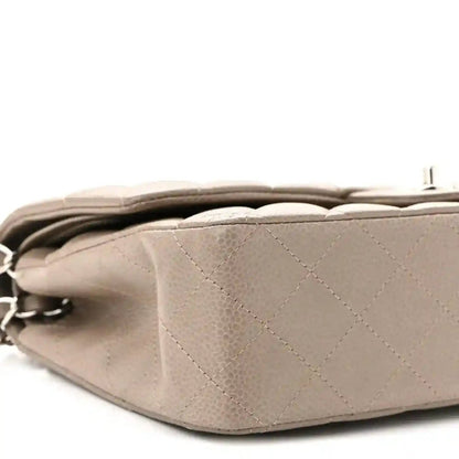 Taupe quilted leather flap bag back view with silver chain strap and hidden fold