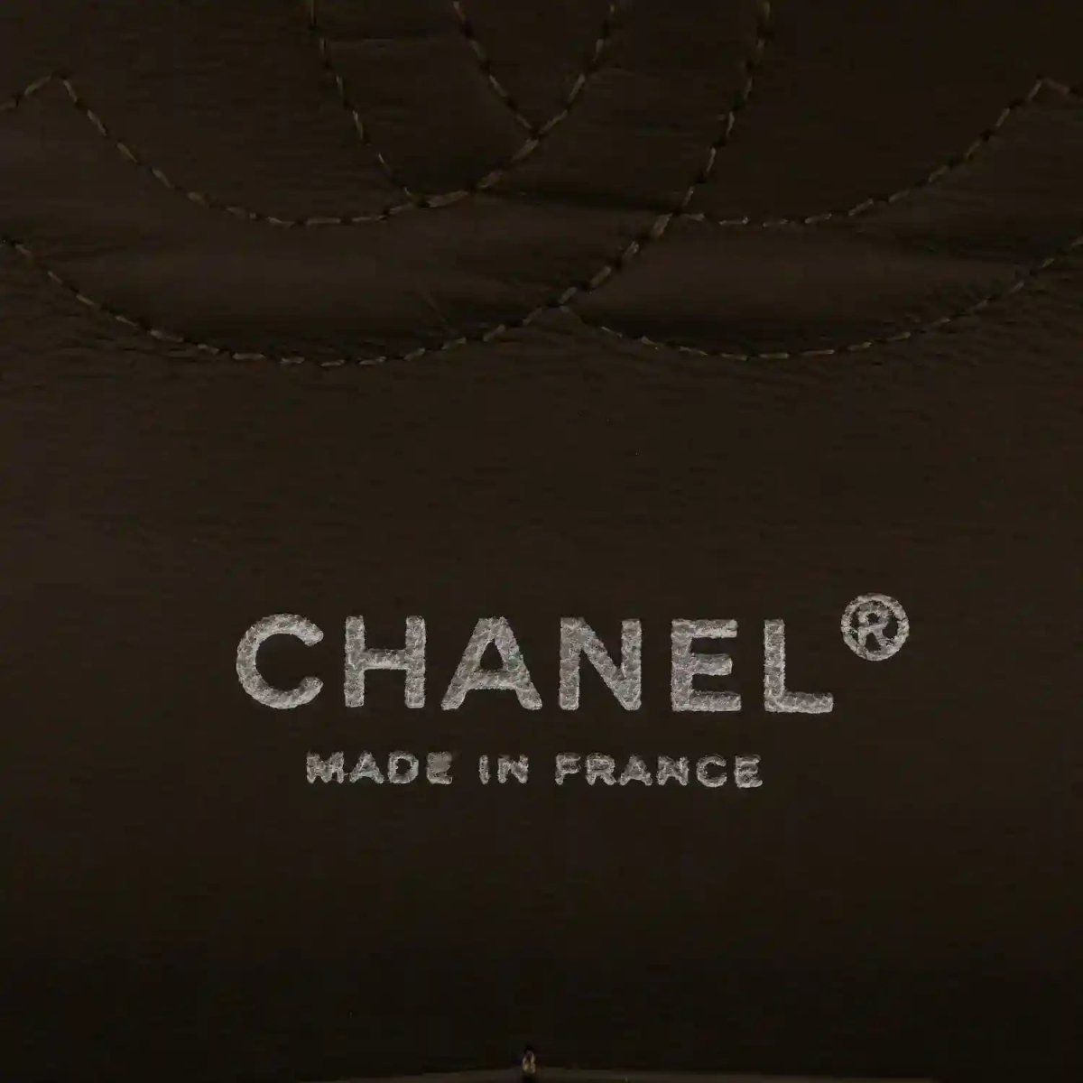 Dark interior lining with stitched diamond pattern and Chanel “Made in France” text