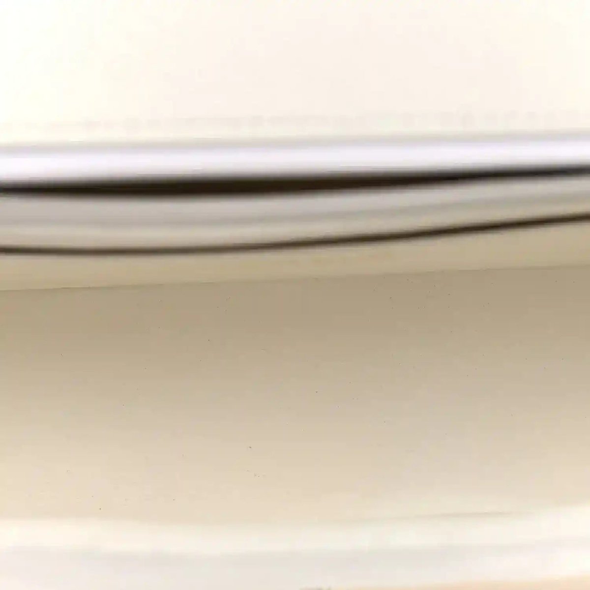 White Chanel bag lining label with CHANEL® text