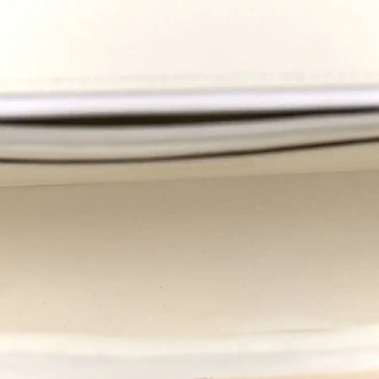 White Chanel bag lining label with CHANEL® text