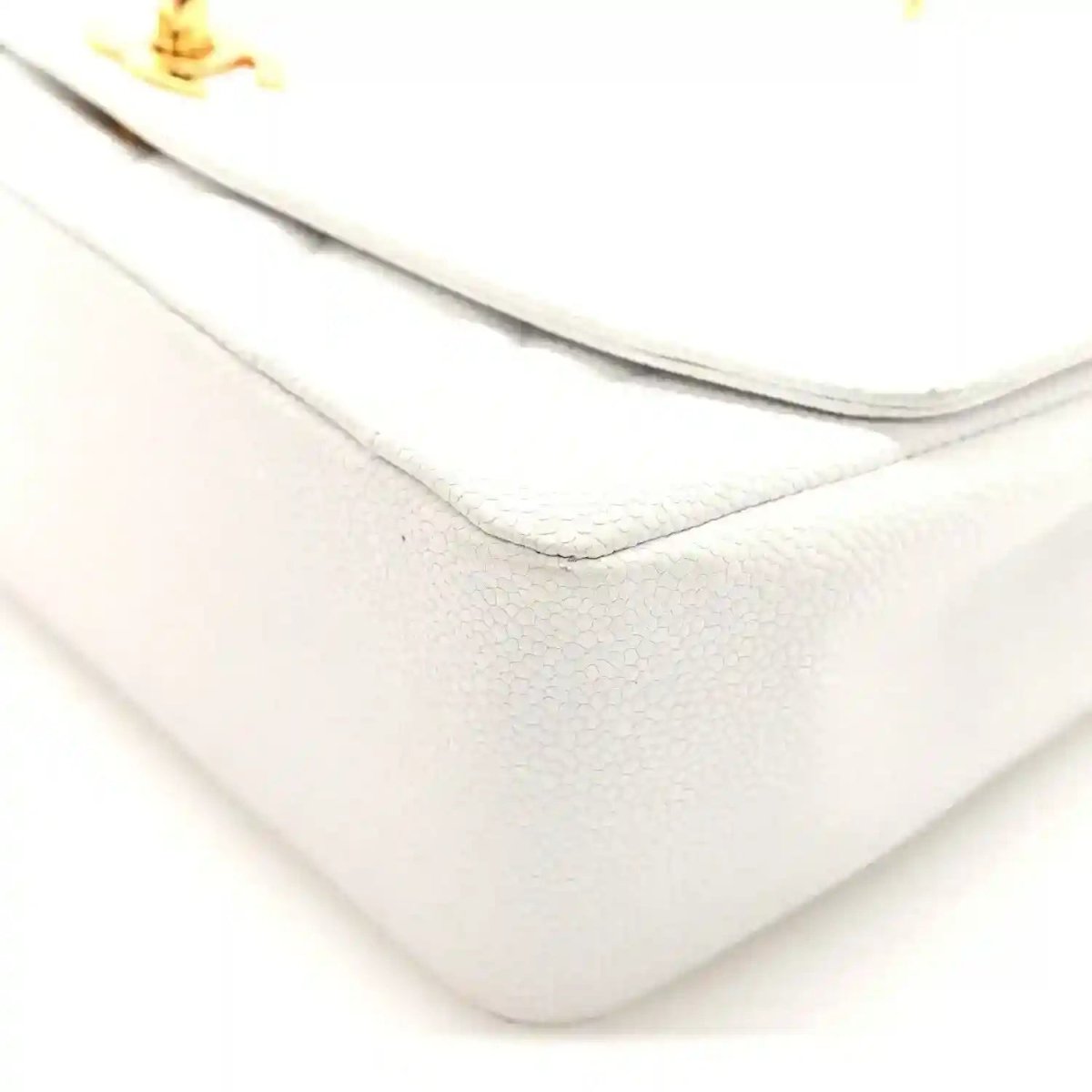 White Chanel quilted single-flap bag side seam with subtle caviar texture