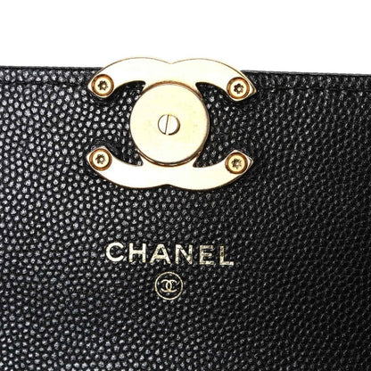 Chanel caviar quilted mini wallet on chain close-up of gold lock and logo