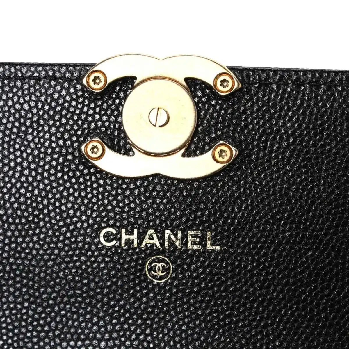 Chanel caviar quilted mini wallet on chain close-up of gold lock and logo