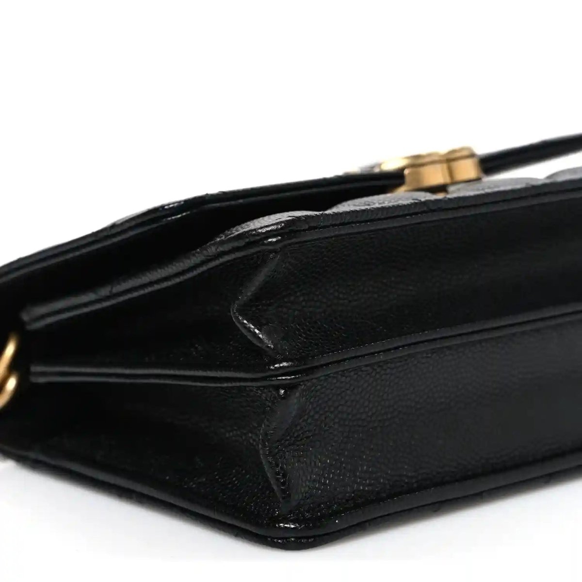 Chanel caviar quilted mini wallet on chain corner close-up with gold hardware