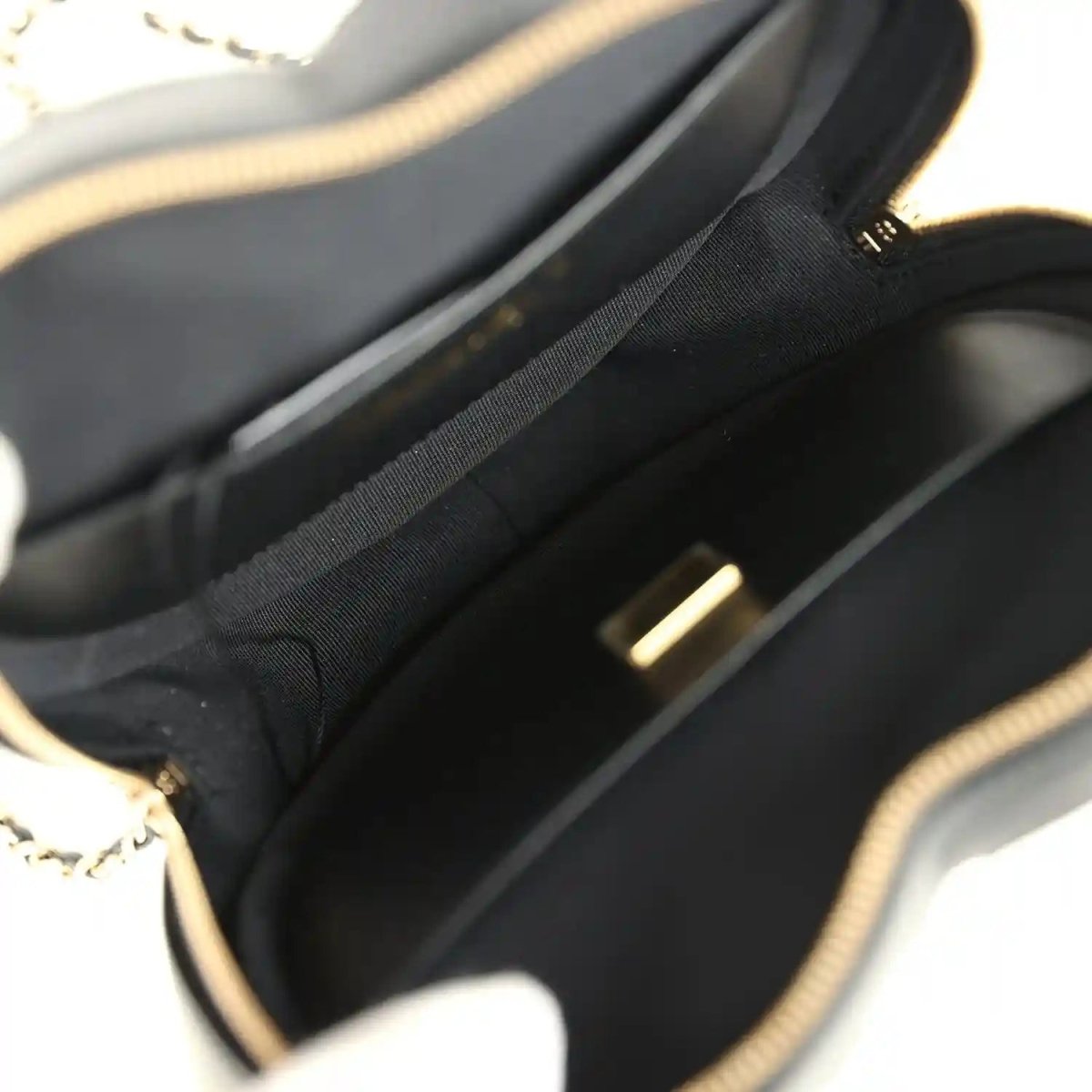 Chanel heart bag interior lining with zip-top opening and black fabric lining