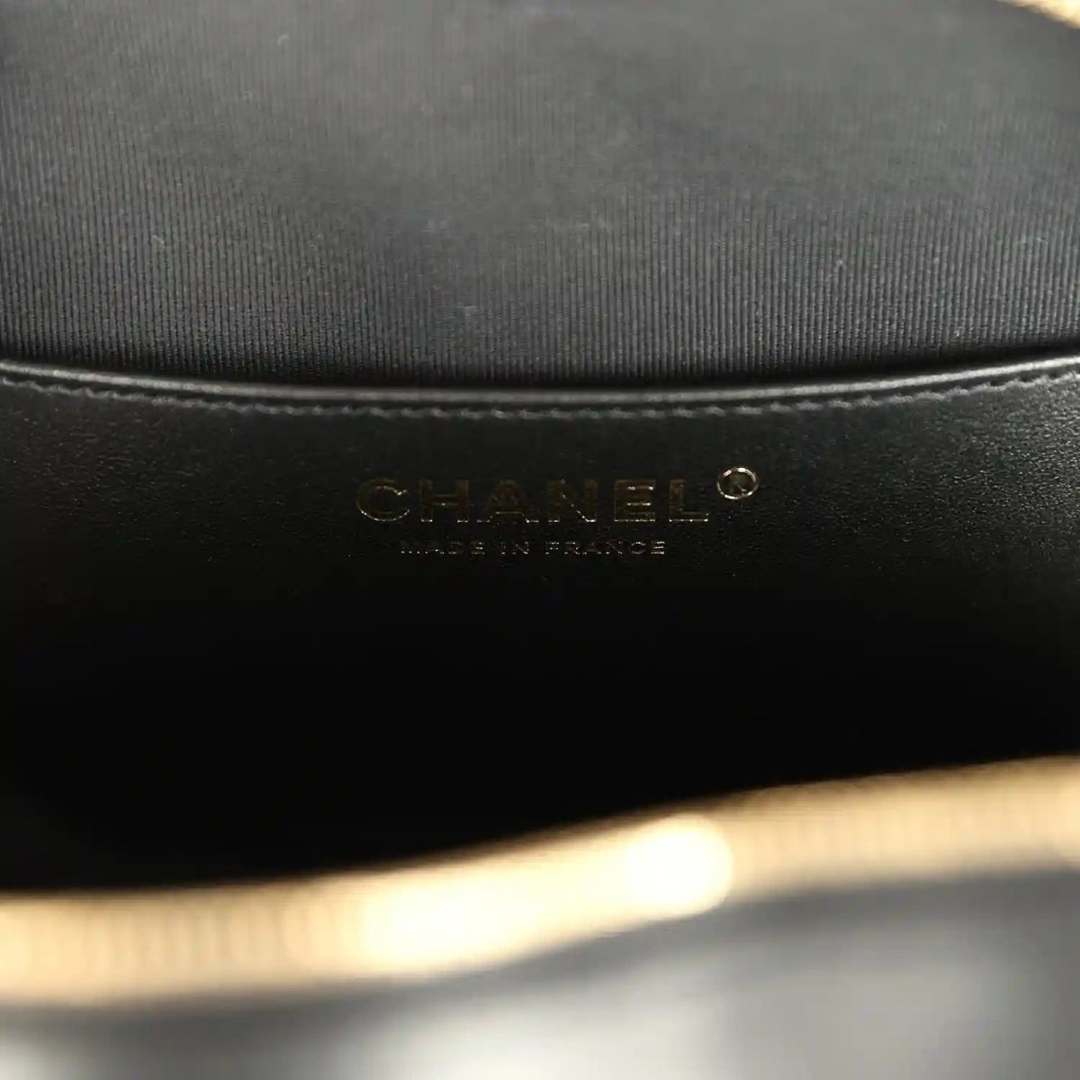 Chanel interior brand label on black fabric lining inside heart bag